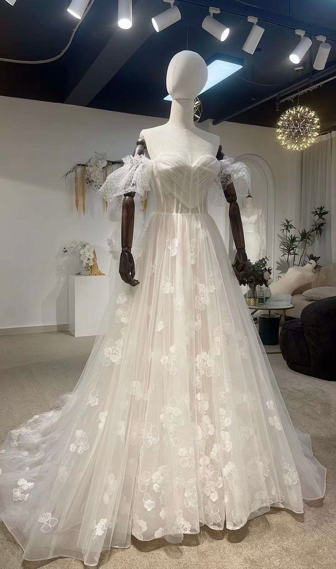 Off the shoulder fairy corset wedding dress, unique boho custom gown f Shindig Threads Off the shoulder fairy corset wedding dress, unique boho custom gown f Shindig Threads