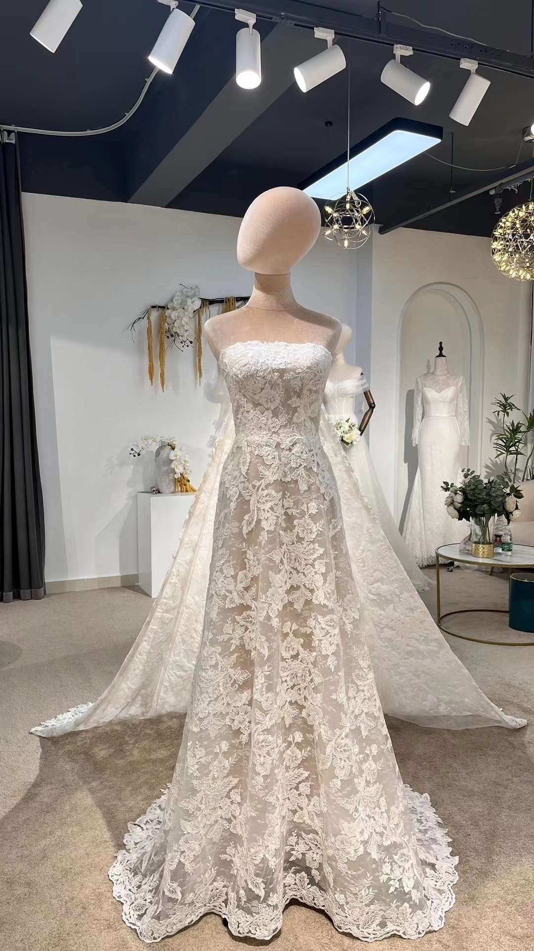 fairy bridal dress zcbang Beach Wedding Dresses for Bride Forest Floral White Tiered Tulle Colorful Lace Applique Wedding Ball Gown Backless Gown at Amazon Women's Clothing store loop closure at the back ensure a seamless fit Fairy-inspired Floral Wedding Dress 0168